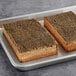 A tray of Thrilling Foods Plant-Based Vegan Bakon Strips on a gray surface.