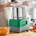 A man using an AvaMix stainless steel food processor.