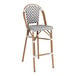 A Lancaster Table & Seating outdoor barstool with a woven chevron seat in gray and white.