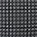A close up of a black and white woven fabric with white dots.
