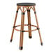 A Lancaster Table & Seating black Teslin backless barstool with a round seat.