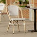 A Lancaster Table & Seating gray chair on a patio.