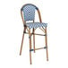 A blue and white chevron weave rattan bar stool.