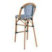 A navy and white chevron weave rattan outdoor barstool.