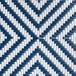 Close-up of the woven navy and white chevron pattern on a Lancaster Table & Seating outdoor barstool.