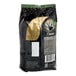 A bag of Nescafe Whole Bean Espresso with a black label on a white background.