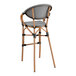 A black and white Teslin outdoor arm barstool with a wooden frame and backrest.