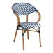 A navy and white chevron weave rattan arm chair.