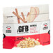 A white and red box of The GFB Apple Cinnamon Oatmeal packets with a bowl of cereal and sliced apple on the front.