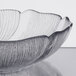 A close up of an Arcoroc Fleur Compote glass bowl with a patterned design.