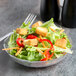A close-up of a salad in an Arcoroc Fleur Compote.