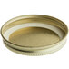 A close up of a gold metal 63/400 jar lid with a plastisol liner.