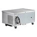 A stainless steel refrigerated chef base with two drawers and caster wheels.