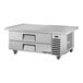 A True stainless steel chef base with two drawers.