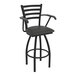 A black Holland Bar Stool Jackie Ladderback swivel bar stool with arms and a black cushion.
