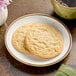 Two Otis Spunkmeyer sugar cookies on a white plate.