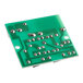 A green Galaxy LED circuit board with silver metal screws.