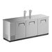 A stainless steel counter with two taps and two doors.