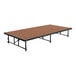 A National Public Seating stage platform with a wooden top.