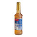 A Torani Winter Spice flavoring syrup bottle with a blue label.