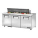 A True TSSU-72-16-HC refrigerated prep table with food on it.
