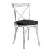 A white Lancaster Table & Seating outdoor chair with a black cushion.