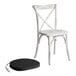 A white Lancaster Table & Seating outdoor cross back chair with a black cushion.