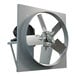 A metal Canarm wall exhaust fan with a belt drive and a fan on it.