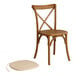 A Lancaster Table & Seating Vineyard Series wooden outdoor cross back chair with a tan cushion and pad.