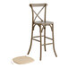 A Lancaster Table & Seating Vineyard Series Whiskey Brown wooden outdoor cross back bar stool with a Chardonnay Tan linen cushion on the seat.