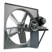 A white metal Canarm belt drive wall fan with a motor.