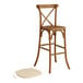 A Lancaster Table & Seating outdoor cross back bar stool with a Chardonnay tan cushion.