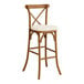 A Lancaster Table & Seating Vineyard Series Barrel Brown outdoor bar stool with a white cushion.