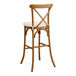 A Lancaster Table & Seating Vineyard Series Barrel Brown outdoor cross back bar stool with a white cushion.