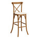 A Lancaster Table & Seating wooden bar stool with a white cushion.