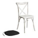 A white Lancaster Table & Seating outdoor cross back chair with a black cushion pad.