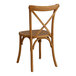 A Lancaster Table & Seating Vineyard Series wooden chair with a cross back.