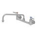 An Eversteel stainless steel wall mount faucet with two silver handles.