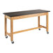 A wooden National Public Seating science lab table with black casters.
