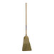 A Seymour heavy-duty contractor corn broom with a wooden handle.