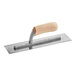 A metal Midwest Rake epoxy mortar trowel with a wooden handle.