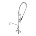 A silver Eversteel deck mount pre-rinse faucet with a hose.