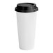 A white Choice paper hot cup with a black lid.