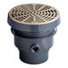 A Sioux Chief PVC floor drain with a round nickel bronze strainer.