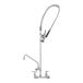 An Eversteel wall-mounted pre-rinse faucet with a silver hose.
