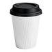 A white Choice paper hot cup with a black lid.