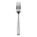 An Arcoroc stainless steel salad/dessert fork with a silver handle.