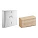 A large stack of Kraft multifold paper towels next to a Lavex stainless steel paper towel dispenser.