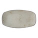 A white rectangular stoneware platter with brown specks on it.