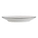 A white porcelain bread and butter plate with a black rim.